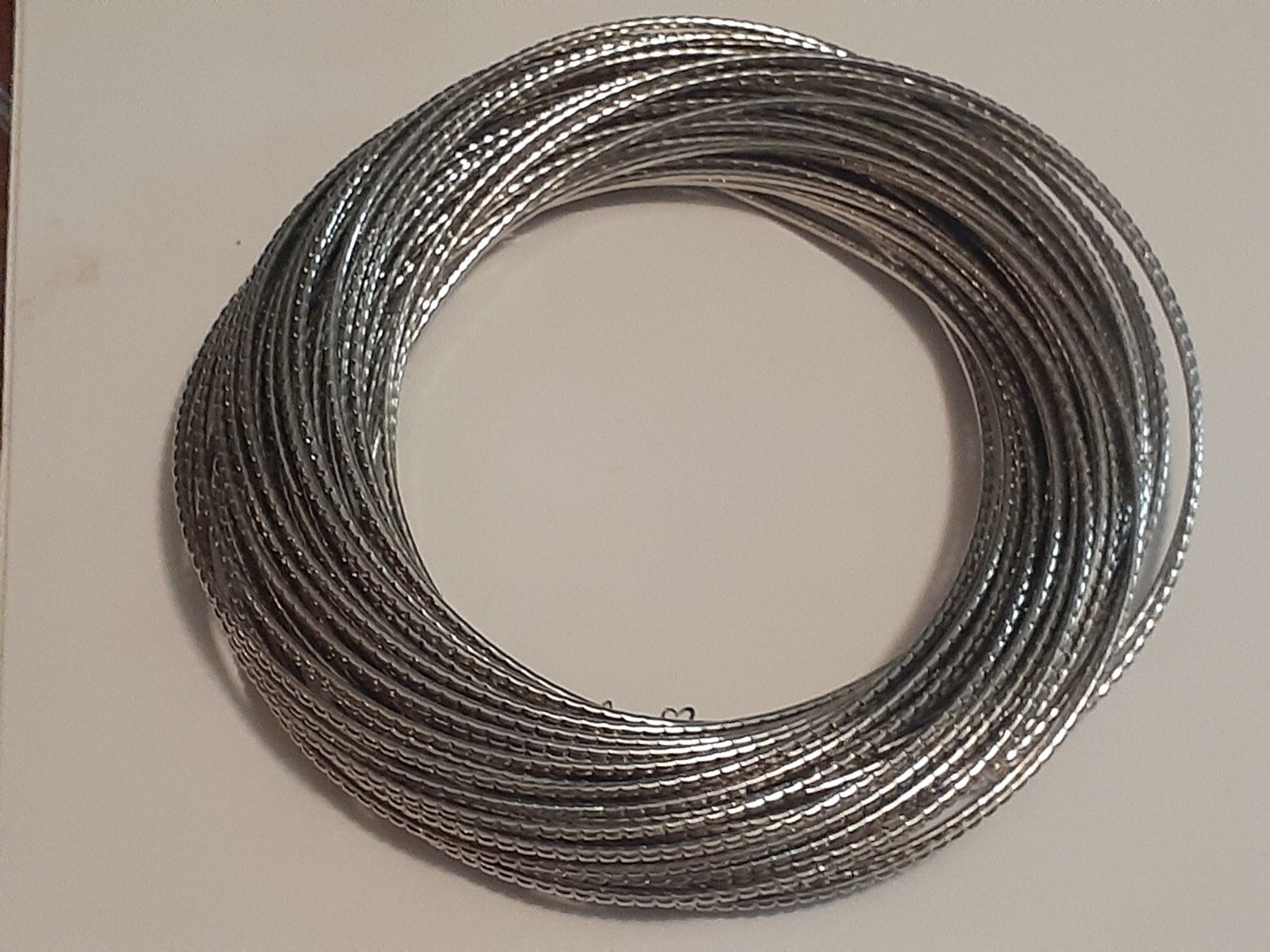 interlocking Silvertone metal bangle bracelets - image 4