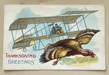 c1914 Thanksgiving Greetings Postcard Turkey Flying With Biplane 