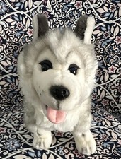 Siberian Husky dog toy with blue eyes and a happy open mouth showing its tongue