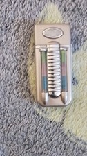 Collectible Silver-Tone Lighter with Unique Colored Tubes Vintage Design