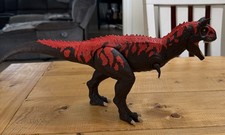 Legacy Collection Reimagined Roarin' Real Feel Carnotaurus Action Figure
