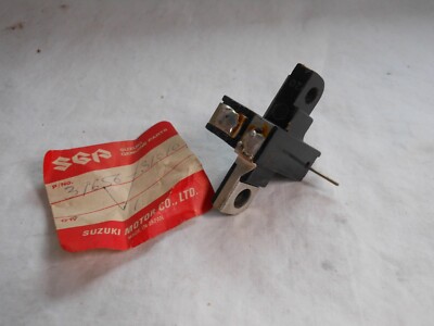 Suzuki, NOS, GT750, Carbon Brush Bolder, # 31656-31012.   J1