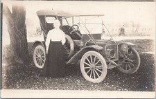 RPPC Woman in Dress posing w/ Early Automobile c. 1910