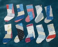 10 PRIMITIVE ANTIQUE CUTTER QUILT STOCKINGS! BLUE RED WHITE, ETC., LOG CABIN!