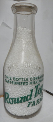 vintage qt pyro milk bottle-Pasteurized milk Round top Farm--Store Bottle (maine