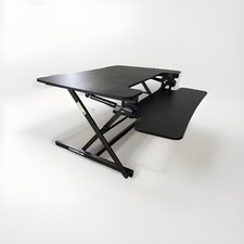 Adjustable desk riser to convert a table into standing desk