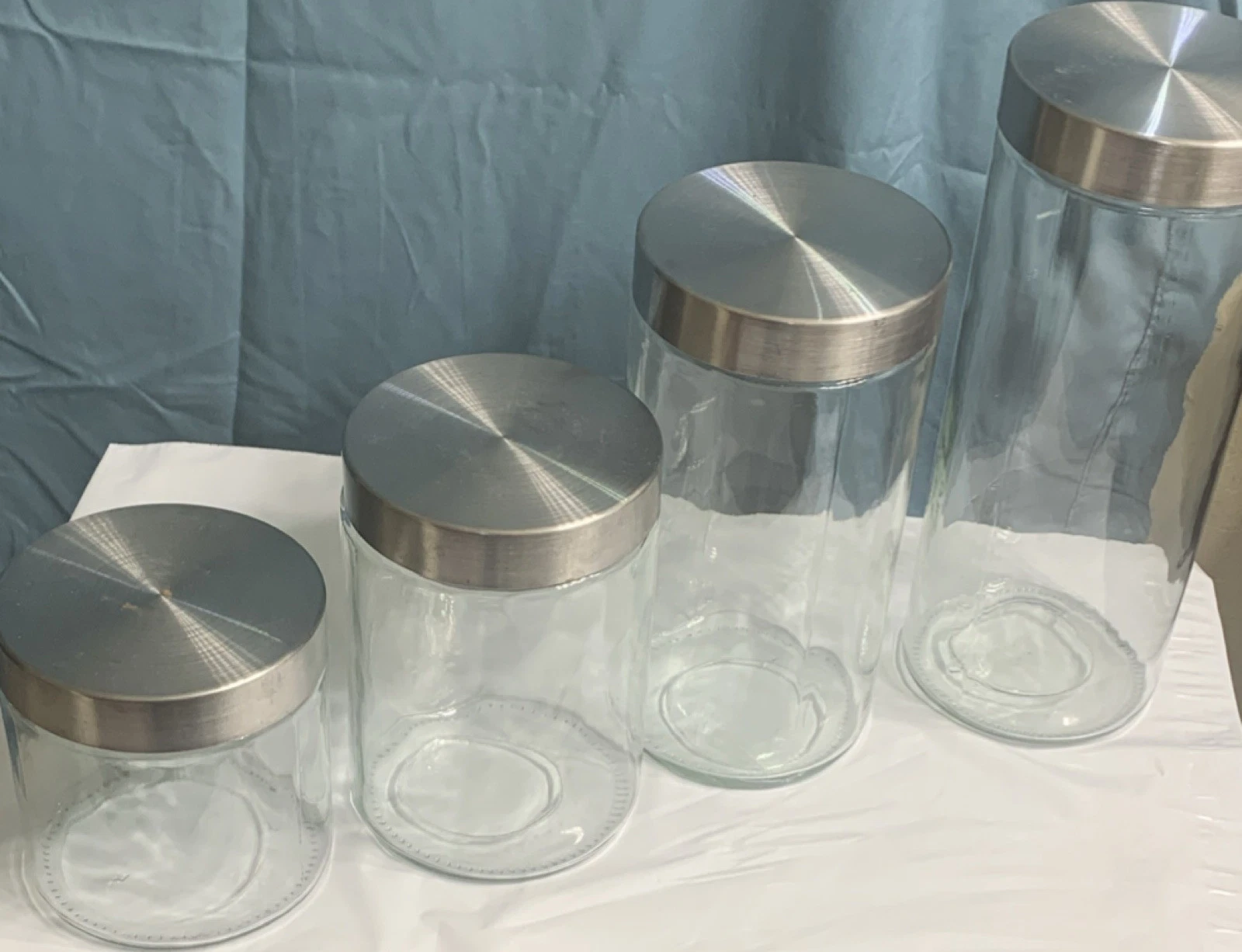 Set of 4 Clear Glass Cylinder Storage Jars with Metal Lids, 10.5-4.5" Heights