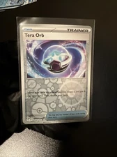 Tera Orb 189/191 Sv08: Surging Sparks Reverse Holo