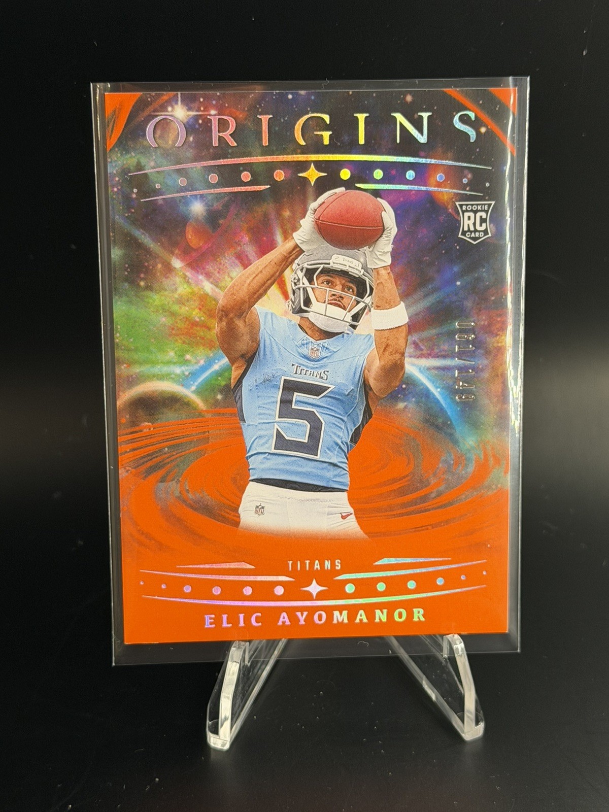 2025 Panini Origins Elic Ayomanor #108 (RC) Rookie Orange 061/149 TITANS