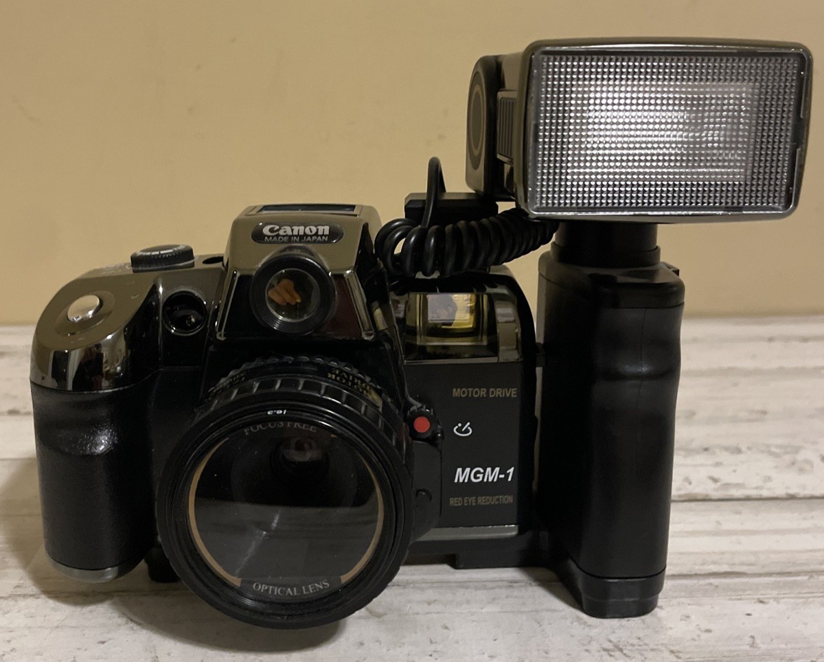Canon Motor Drive MGM-1 Film Camera With 1:6.3 50mm Lens & Flash Canon Motor Drive MGM-1 Film Camera With 1:6.3 50mm Lens & Flash