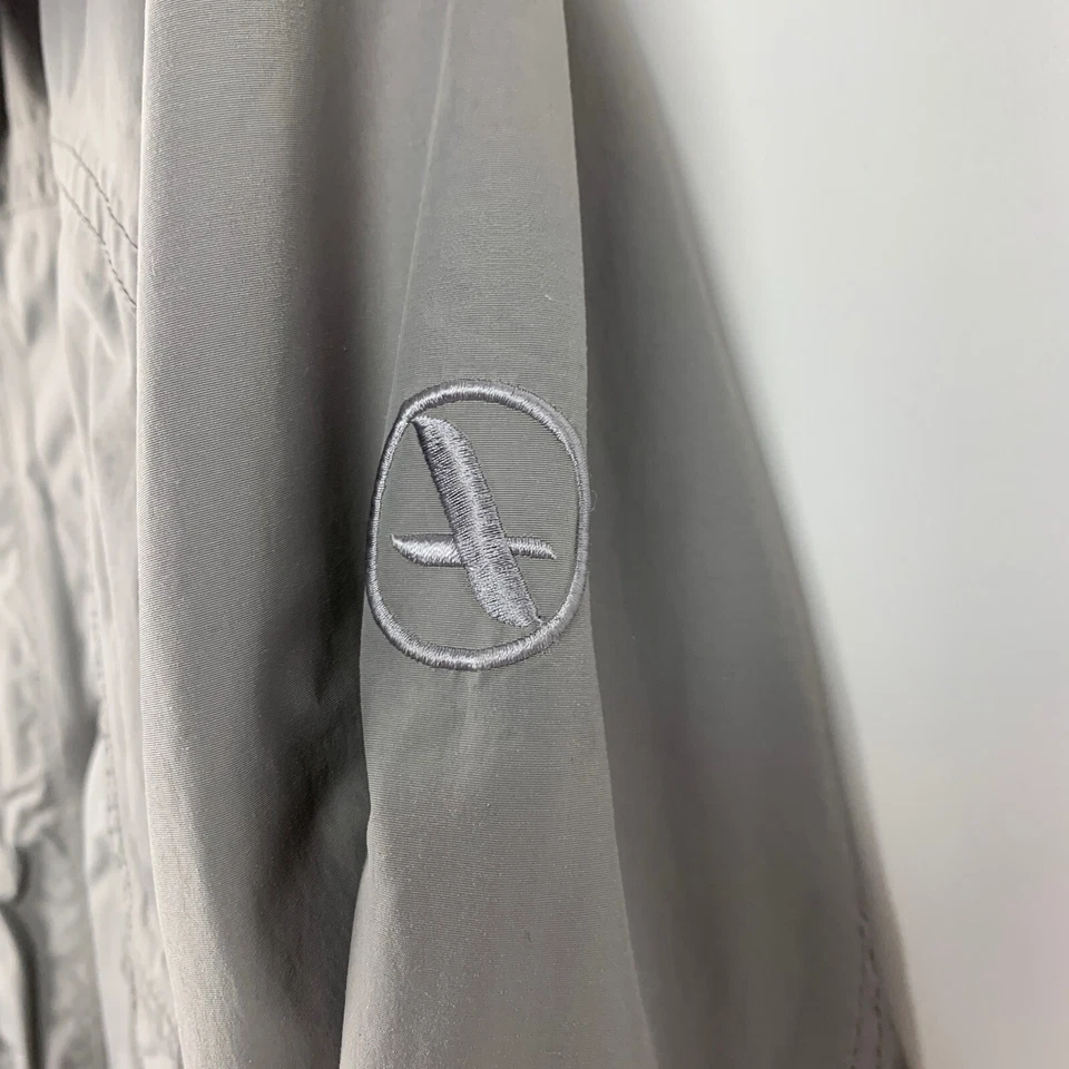 Chaqueta cortavientos Aigle gris cremallera completa agarre para el sol nailon a presión para hombre mediana Foto 4 de 4