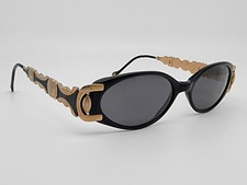 Gafas de sol vintage Revlon Sun 12 marco negro dorado lentes grises 50-16-140