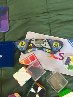 Assorted Rubiks Cubes  Timer plus exclusive clocks, mini cubes, and rare cubes