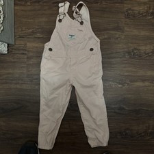 are OshKosh B'gosh light pink denim overalls featuring a signature heart-shaped