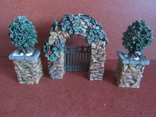 DEPT 56 VILLAGE - STONE CORNER POSTS WITH HOLLY TREE AND STONE ARCHWAY #52648