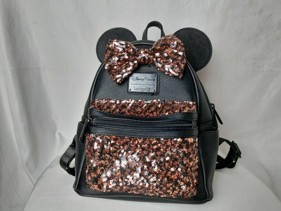 Mochila de bolsillo con lazo y lentejuelas doradas y negras Loungefly de los parques de Disney Foto 2 de 4