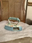 This is a vintage Hull Pottery Bow Knot iron-shaped wall pocket.