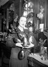 Saleswoman a famous chocolate maker adorning Easter eggs with - 1932 Old Photo