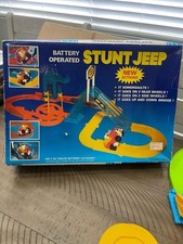 VINTAGE BATTERY OPERATED STUNT JEEP TOY .