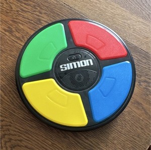 Simon Simon Handheld Electronic Memory Game, Light-Up, Age 8+