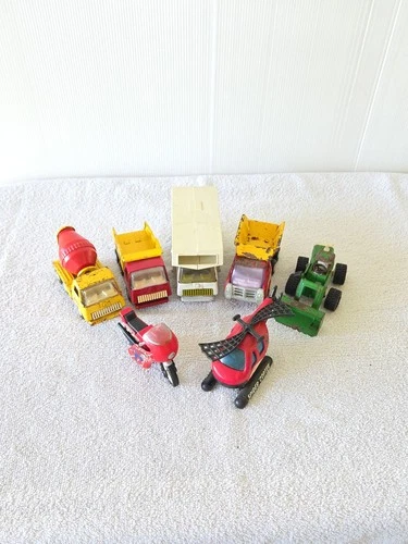 Seven Pieces Pressed Steel Mini Tonka And Buddy L Trucks And A Helicopter