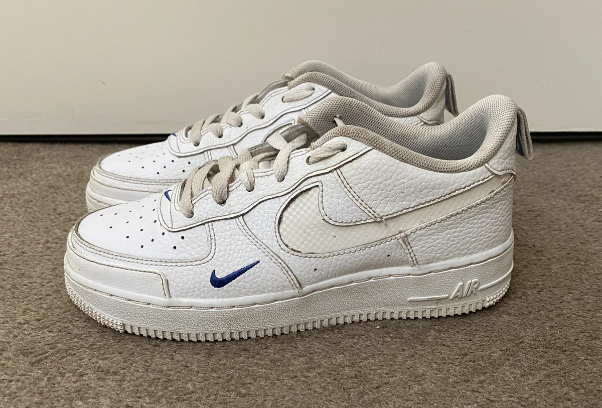 white nike shoes with blue tick