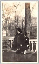 Vtg B&W Snapshot Two Children Winter Coats Standing Outdoors 1920s