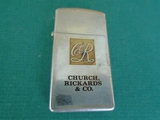 Zippo slim chrome lighter with Church Rickards and Co logo