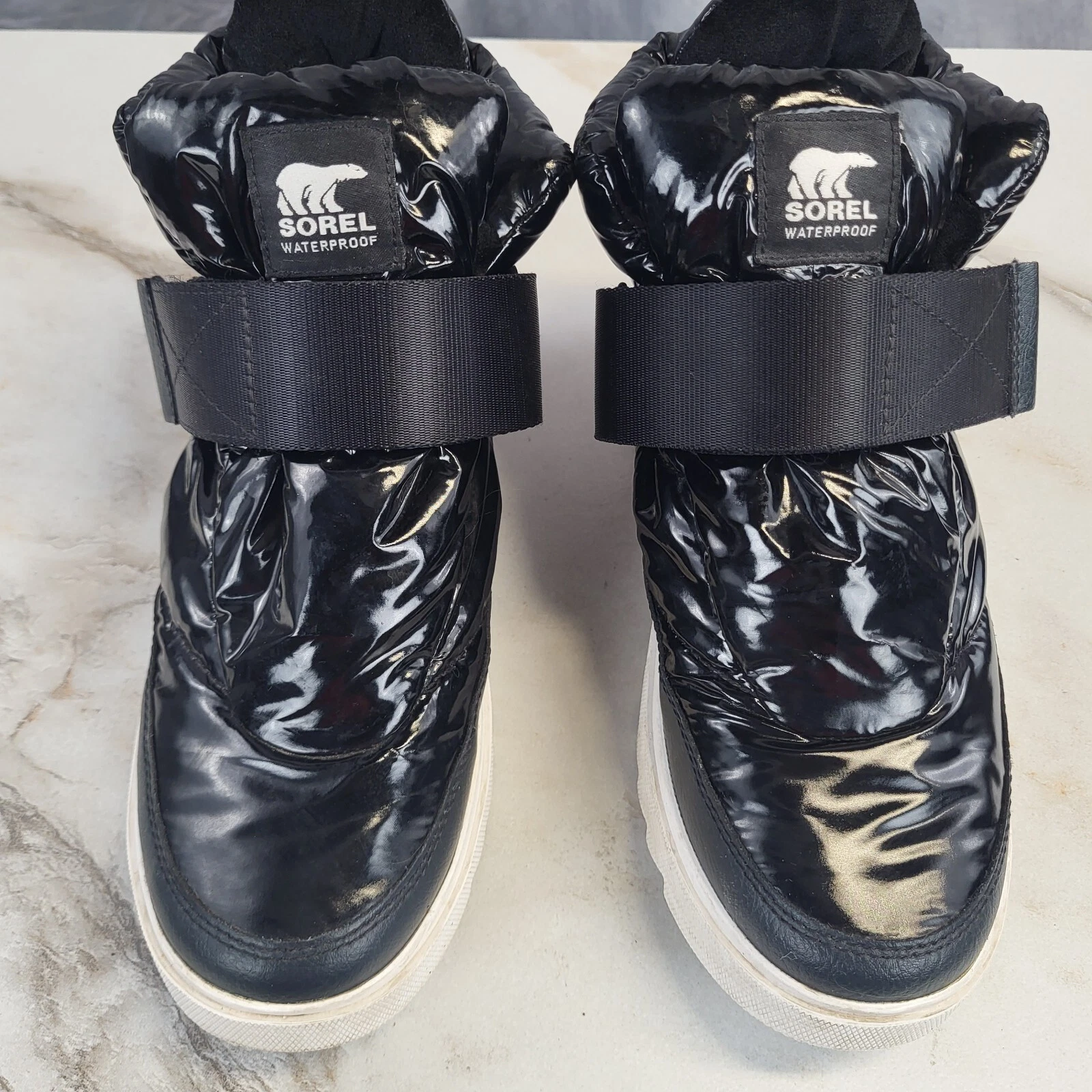 sorel joan of arctic next lite ankle strap puffy sneaker boots