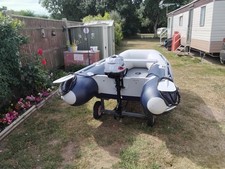 honwave rib with 2.5 horse power outboard and launching trailer