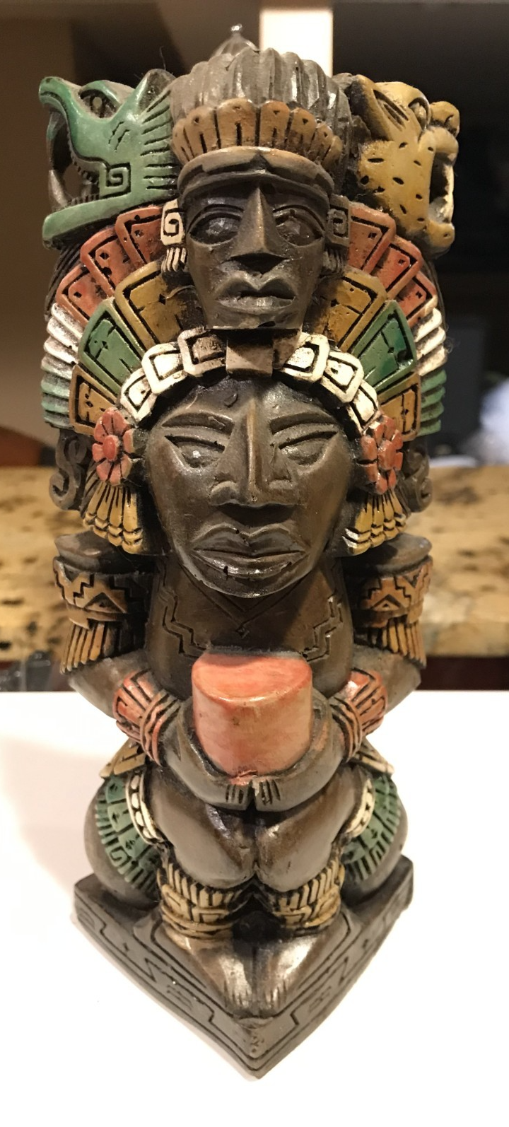 Handmade painted clay Mayan totem statue with intricate designs