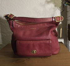 Coach Burgundy Shoulder Bag with Gold Hardware Zipper Buckle Accent Bag Charm