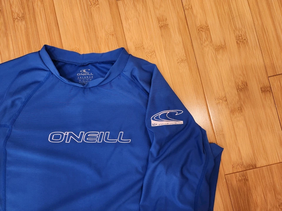 Top protector contra erupciones 2XL azul manga corta O'Neil para hombre Foto 2 de 4