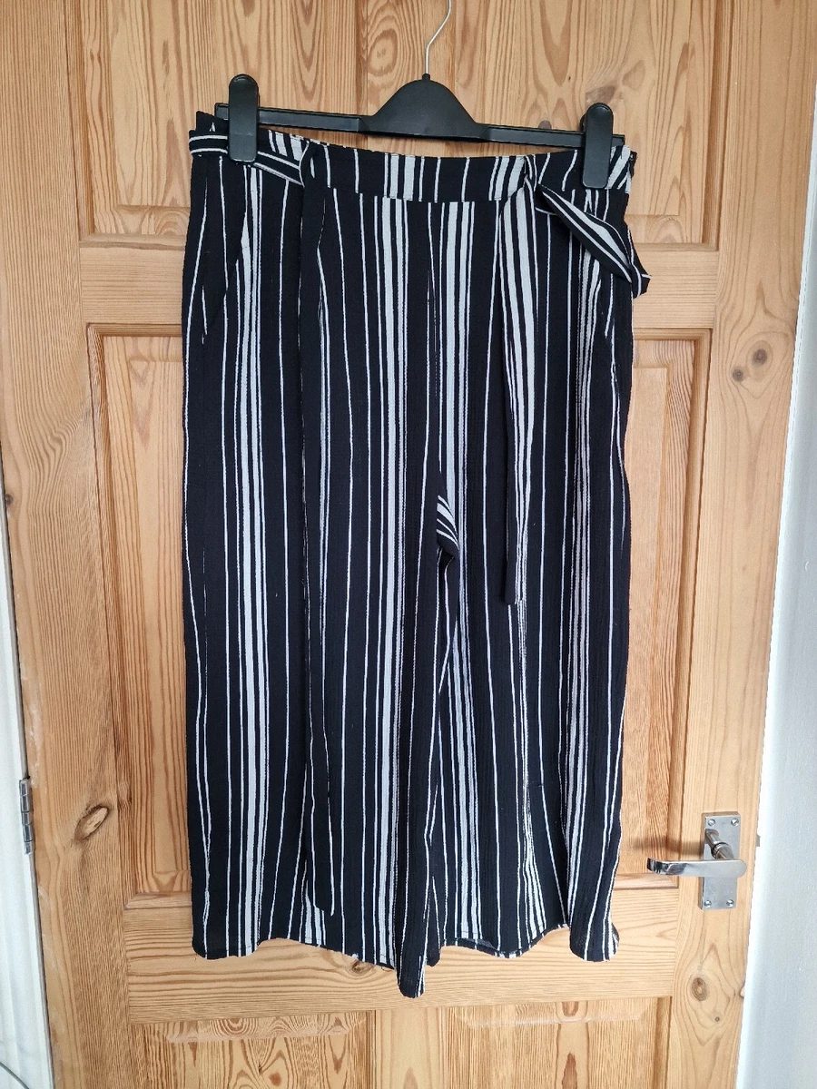 New look black store and white striped trousers