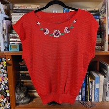 Vintage red floral sweater vest with floral embroidered detail.