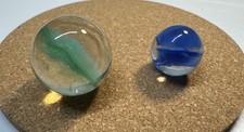 2 Vintage Cat s Eye Marbles Aqua Has Cold Crease / Roll Air Bubbles
