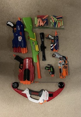 7 Nerf  guns with 40 darts and 3 mega darts. All great condition