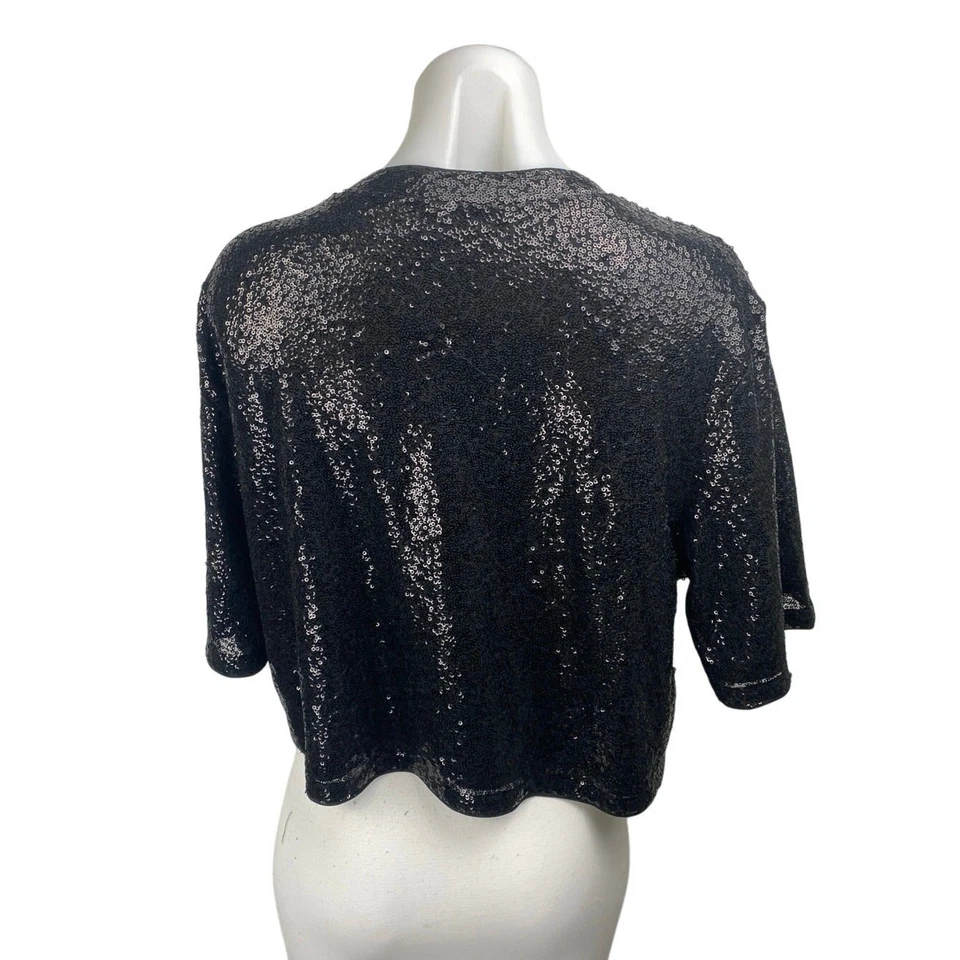 Blusa corta manga corta cuello redondo adornada con lentejuelas negras talla L de H&M para mujer Foto 2 de 4