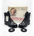 Black leather Chippewa steel toe work boots with black laces, brown soles, and box labeled “Made in U.S.A.”
