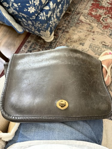 vintage Coach black leather bag,classic front flap and brass turnlock closure.