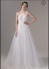 NWT Ivory Wedding Dress petite size with lace details and nude liner.