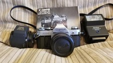 canon ae-1 camera Focal 28mm lens Canon AC 50 mm zoom lens Vivitar 2600-D flash