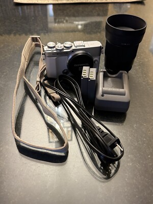 Near Mint Olympus EP7 w/ Sigma 30mm F1.4, 2 batteries, Charger Hub and Leash