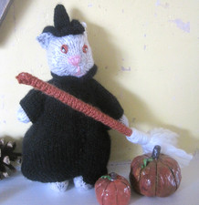 A HALLOWEEN WITCH KITTEN. ALL HAND KNITTED. WITH BROOMSTICK.