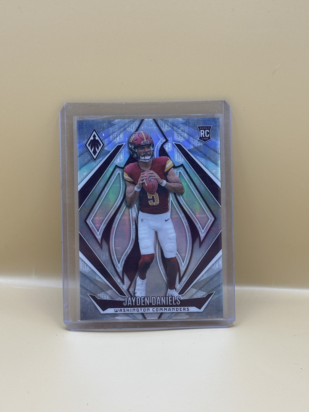 2024 Panini Phoenix - #198 Rookies Jayden Daniels NFL Shield Numbered/150