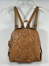 Brown Faux Leather Backpack Purse accented with laser cutouts  studded