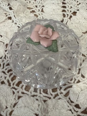 Vintage cut crystal trinket box featuring a delicate pink porcelain rose