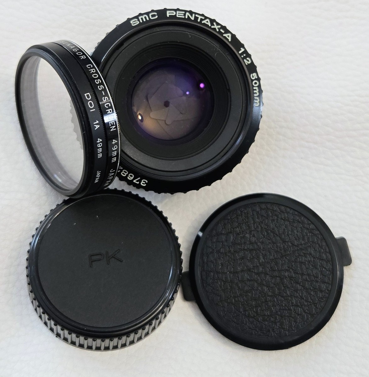 SMC Pentax-A 1:2 50mm lens with both caps and filters. Tested and