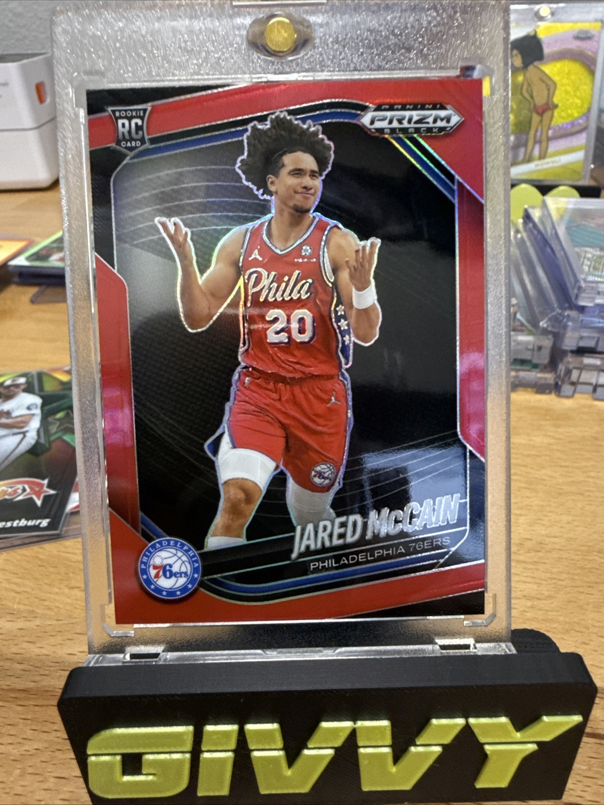 Jared Mccain 2024-25 Panini Prizm Black 122/299 Red RC 76ers #80