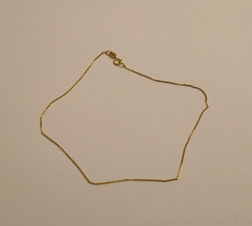 10K YELLOW GOLD ANKLET.